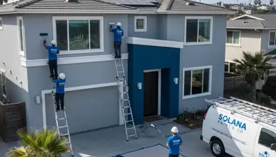 Professional house painters finishing exterior home in La Jolla, CA